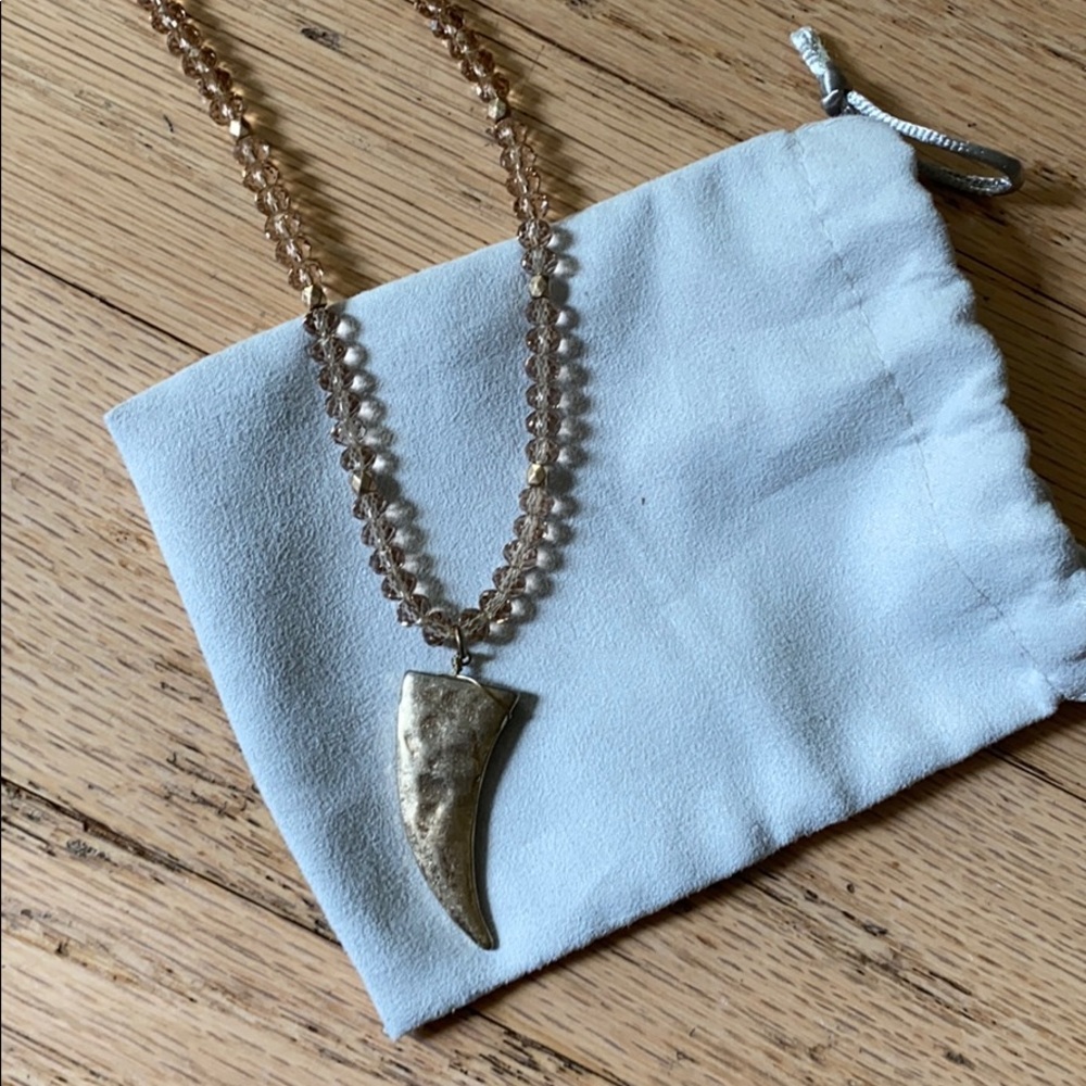 Gold tone horn necklace